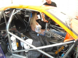 A lucky fan gets her chance to sit in a Pro Stock Car.  Or are we the lucky ones?  Hmmm.