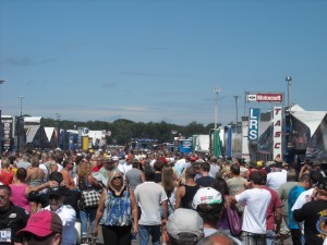 The Pits!  Notice the ear plugging and watery eyes?  That's thanks to Top Fuel and Funny Car test starting, and nitro methane. hehe!  Nothing like a shot of nitros in the mornin!