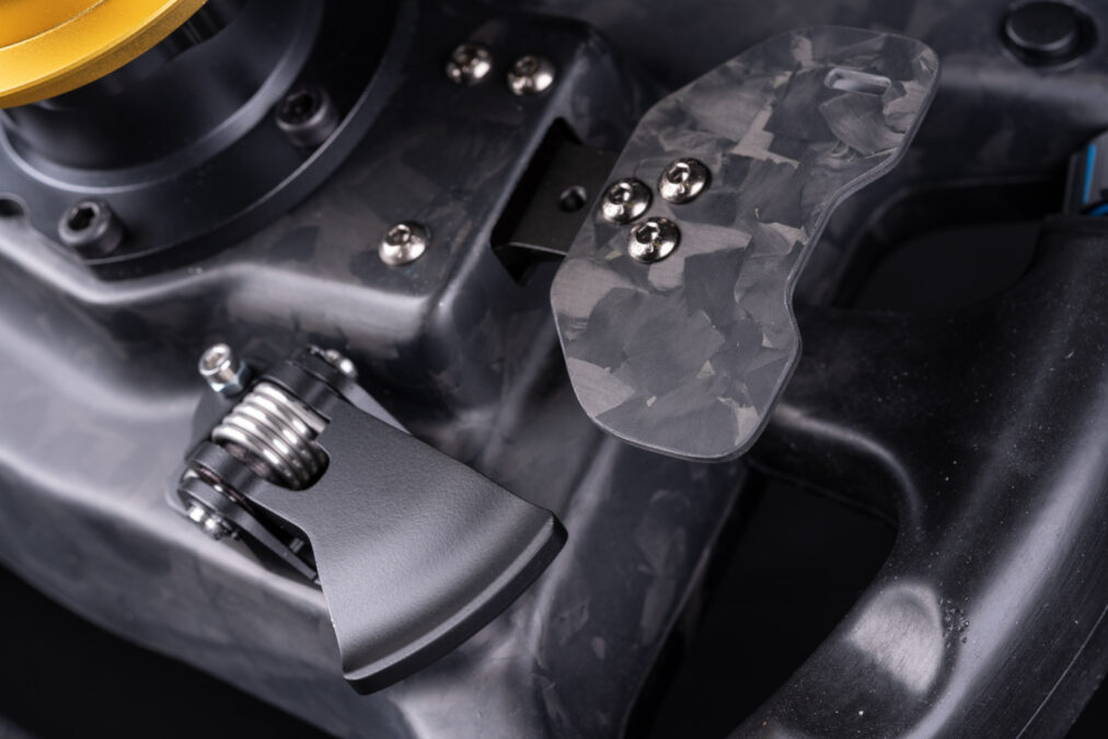 Dual-action magnetic shifter paddles and two dual-Hall sensors clutch paddles